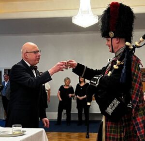 a wee dram with the piper on Burns Night